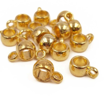 Distanziatore oro con asola 9x3.7 mm foro 3.6 mm 20 pz Distanziatore oro con asola 9x3.7 mm foro 3.6 mm 20 pz